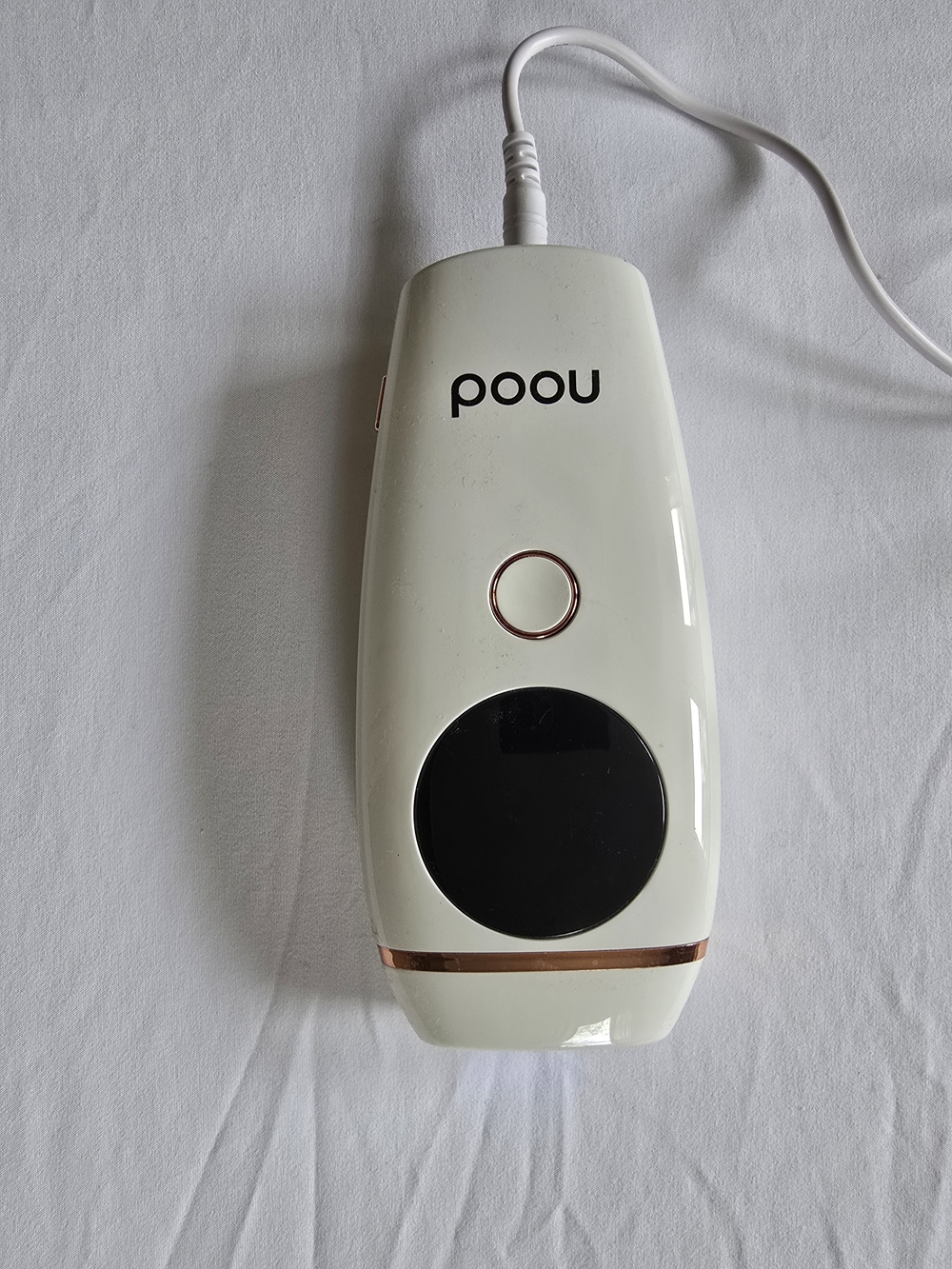 Nood Handheld Beauty Device in White with Rose Gold Accents